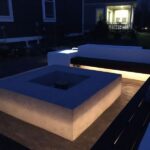Contemporary Patio with Integrated Outdoor Lighting and Fire Pit