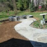 Stone Fire Pit with Flagstone Pathway